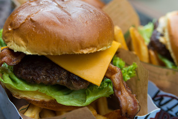 Delicious fresh burger close up. Selective focus with shallow depth of field