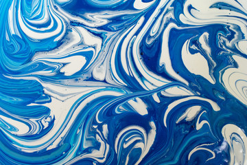blending of blue color with white acrylic paint, abstraction