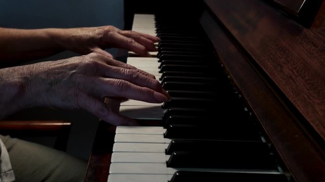  Old Woman With Wrinkle Hands Playing On A Piano