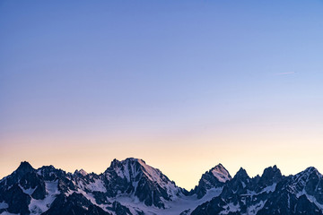 Scenic view of beautiful Swiss Alps mountains. Blue hour sunset with pink and blue tones, Verbier, Canton du Valais, Wallis, Switzerland.