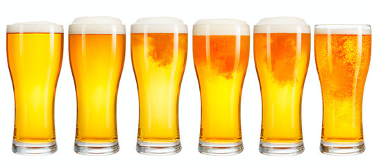 Set of a glass of cold light beer with foam isolated on white background