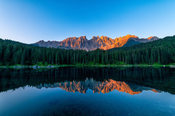 Naklejka na ściany i meble Lake Carezza during sunrising on summer with beautiful reflection 