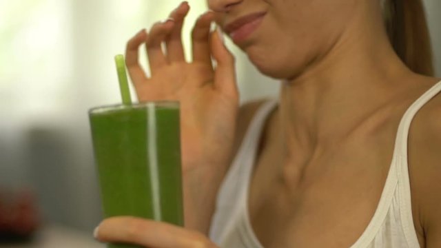 Girl feels disgust to smoothie for weight loss, healthy but tasteless nutrition