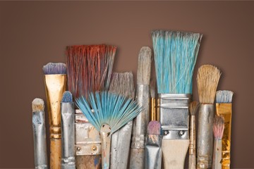 Artist paint brushes and paint cans