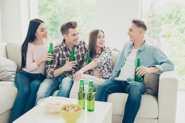 Handsome, attractive guy in a blue shirt tells a story to his ca