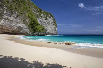 Interesting shadows and white sand at Kelingking Beach on Nusa Penida in Indonesia.