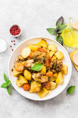 Roasted potato and carrot with lemon, garlic, spicy dressing. Top view, space for text.