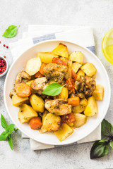 Roasted potato and carrot with lemon, garlic, spicy dressing. Top view, space for text.