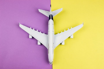 Plane, aircraft on color background. Travel concept. Empty space for text and design.