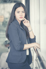 Asia young businesswoman at gate waiting in terminal. Air travel concept.