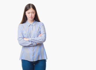 Young Chinese woman over isolated background skeptic and nervous, disapproving expression on face...