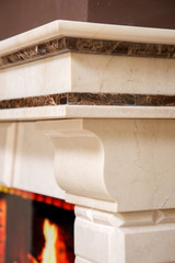 White marble fireplace mantel corner cornice detail with dark inlay band and corbel © Olexandr Tytarchuk