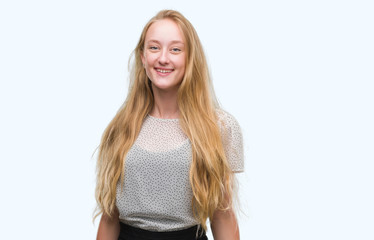 Blonde teenager woman wearing moles shirt with a happy and cool smile on face. Lucky person.