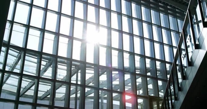 Walking inside the building with window sunlight flare