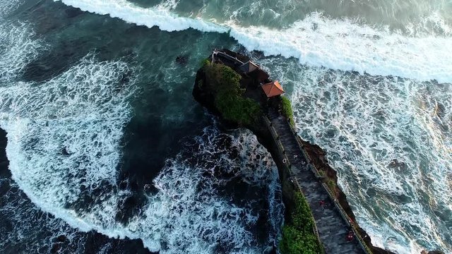 Sunset aerial view of the South-West coast of Bali, Indonesia. Tanah Lot Temple, Batu Bolong Temple.