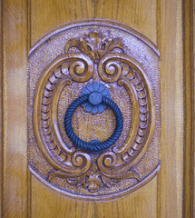 lion head knocker of an antique wooden door