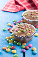 Sweet cupcakes with candies.