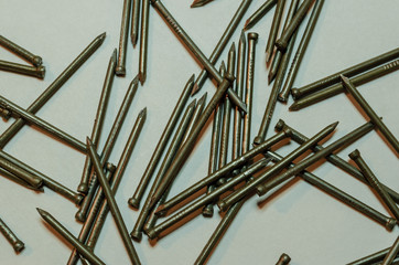 Close-up overhead view of scattered finishing nails