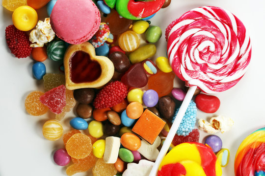 candies with jelly and sugar. colorful array of different childs sweets and treats.