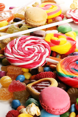 candies with jelly and sugar. colorful array of different childs sweets and treats.