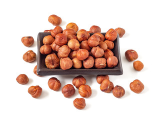 Handful of hazelnuts in a plate