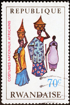 Traditional african dresses on postage stamp of Rwanda