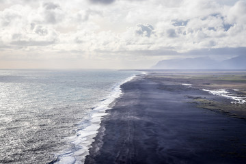 Naklejka na ściany i meble Black sand beach in Vik (Iceland)