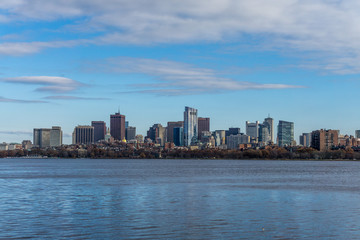 The Boston skyline and Charles River, seen from Cambridge with clouds, Massachusetts.