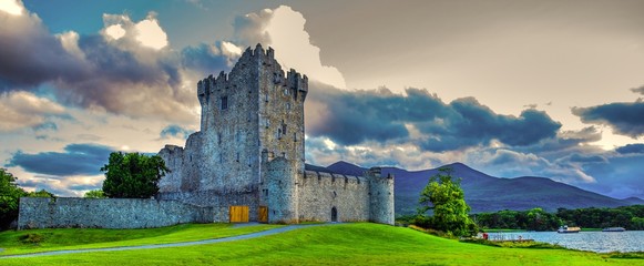 Idyllic landscape of Ross Castle in the Killarney National Park in Ireland. Travel by car through...