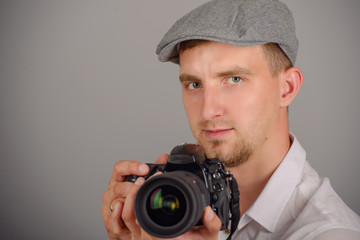 Young man using a professional camera