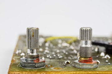Old integrated circuits in an analog radio receiver. Resistors, transistors and other circuits on...
