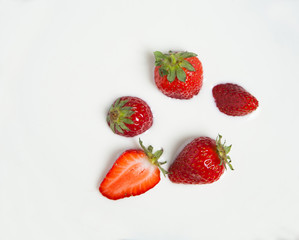 Isolated chopped strawberries on white background