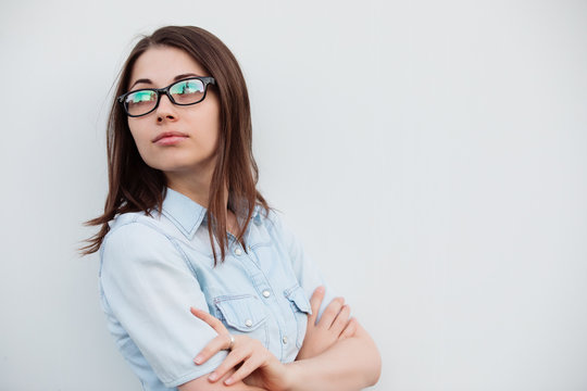 Eyeglasses for good vision, girl on white background with bad sight