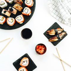 Sushi assortment on white background. Flat lay, top view Japanese cuisine concept.