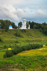 White stone Ascension Cathedral on the picturesque steep slope of the Volga river, Rzhev town, Russia.
