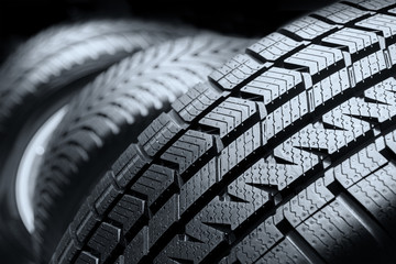 Row of car tires close up - obrazy, fototapety, plakaty