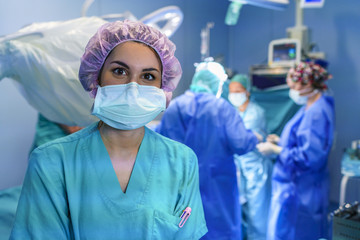 Surgery assistant looking at the camera