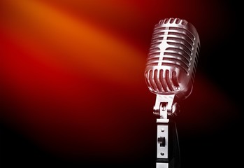 Retro style microphone on background