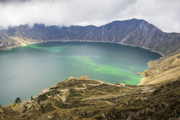 Naklejka na ściany i meble A panoramic view of Quilotoa lake, which is a volcano crater in the Andean Region of Ecuador.