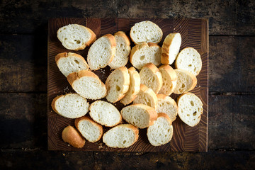 Sliced bread for healthy salad on the wooden cutting board,selective focus