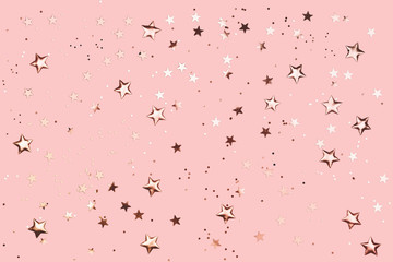 Rose gold decorations on pink pastel background.