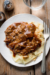 Pulled beef in barbecue sauce with mashed potatoes & crisp fried onions