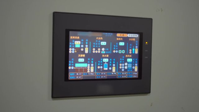 Status and control screen for equipment box. Touchscreen interface on monitoring equipment. Industrial equipment screen for status and modification.