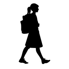 Obraz na płótnie Canvas Isolated silhouette of a girl with school backpack going to school