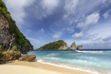 Fototapeta na wymiar A beautiful rock formation just off the shore of Atuh beach on Nusa Penida near Bali.