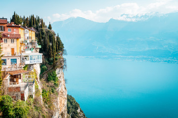 The cliffs of Tremosine sul Garda, view to the balconies at the cliffs next to the abyss, in the background Lake Garda, Italy