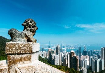 Hong Kong skyline in Tai Ping Mountain or Victoria Peak with a tiger statue