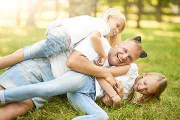 Fototapeta premium One father plays nature with his daughter.