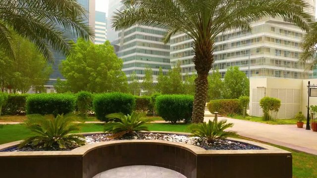Abu Dhabi city small park as an entrance to an apartment building