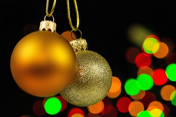 Golden Christmas Balls with Blurred Lights on Background